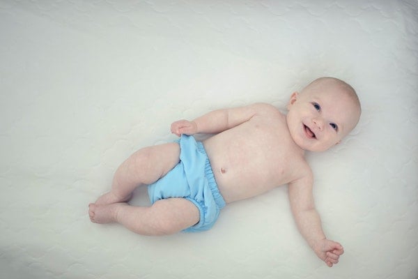 baby waking up as mother logs the nap | The Peaceful Sleeper 