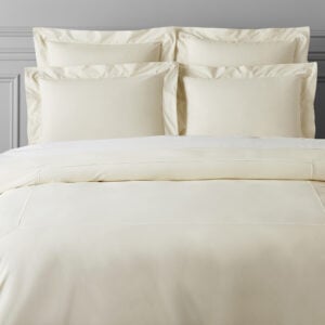 white bed sheets and pillows to represent how  how our online CBT-I course can treat adult insomnia and help you sleep more!