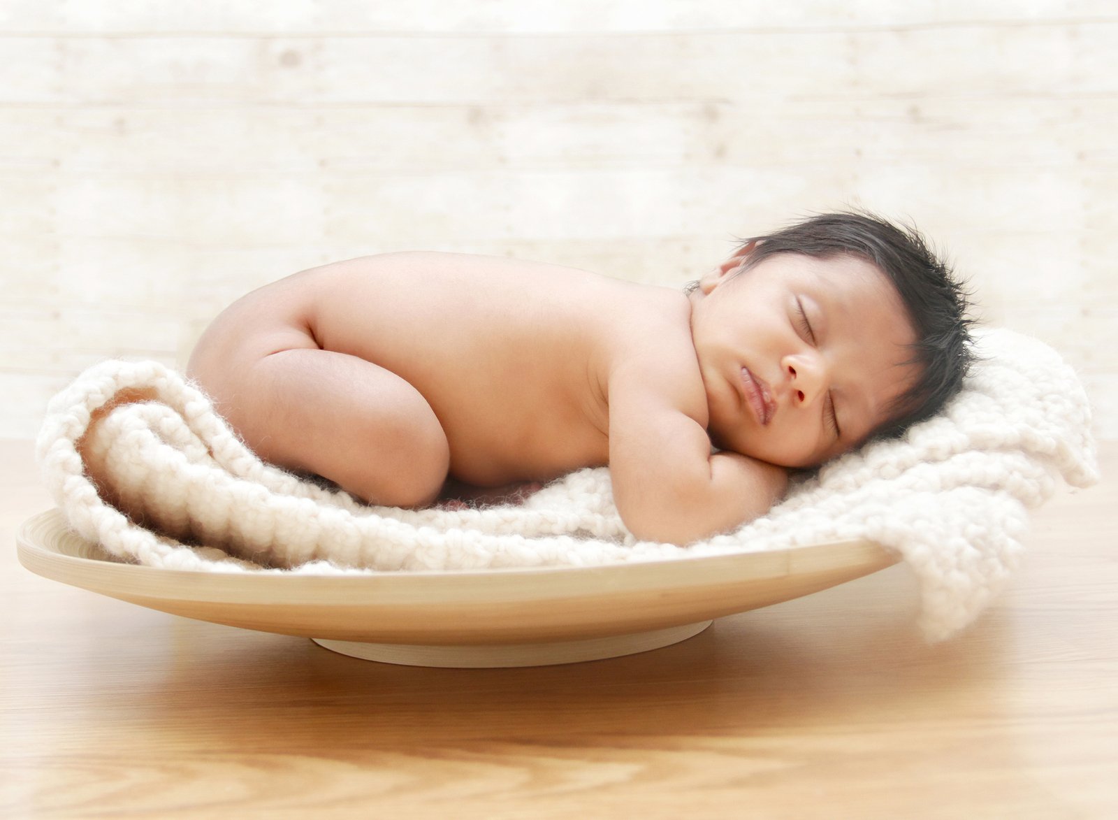 Baby Sleeping in a Wooden Bowl with a blanket | Baby Sleep Training Expert Sleep Consultant | The Peaceful Sleeper