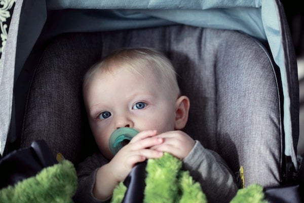 a baby about to nap while traveling in a car | The Peaceful Sleeper 