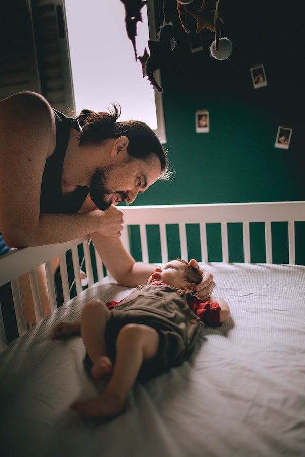 father helping a baby transition from co sleeping | The Peaceful Sleeper 