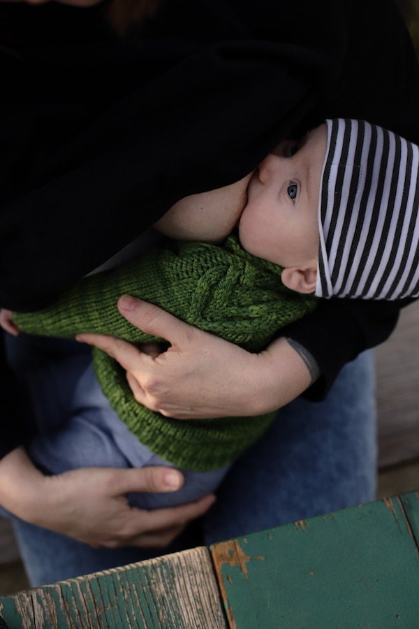 baby being breastfed in the best position to reduce gas | The Peaceful Sleeper 