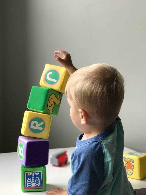 toddler playing with blocks | The Peaceful Sleeper 