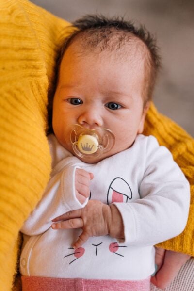 Newborn with pacifier |The Peaceful Sleeper