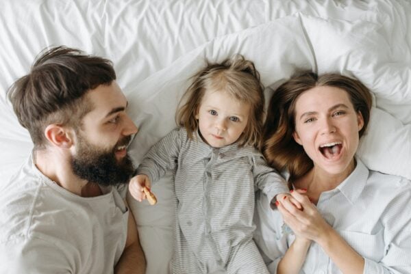 Parents and Toddler in Bed | The Peaceful Sleeper