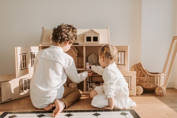 Children Playing With a Dollhouse | The Peaceful Sleeper
