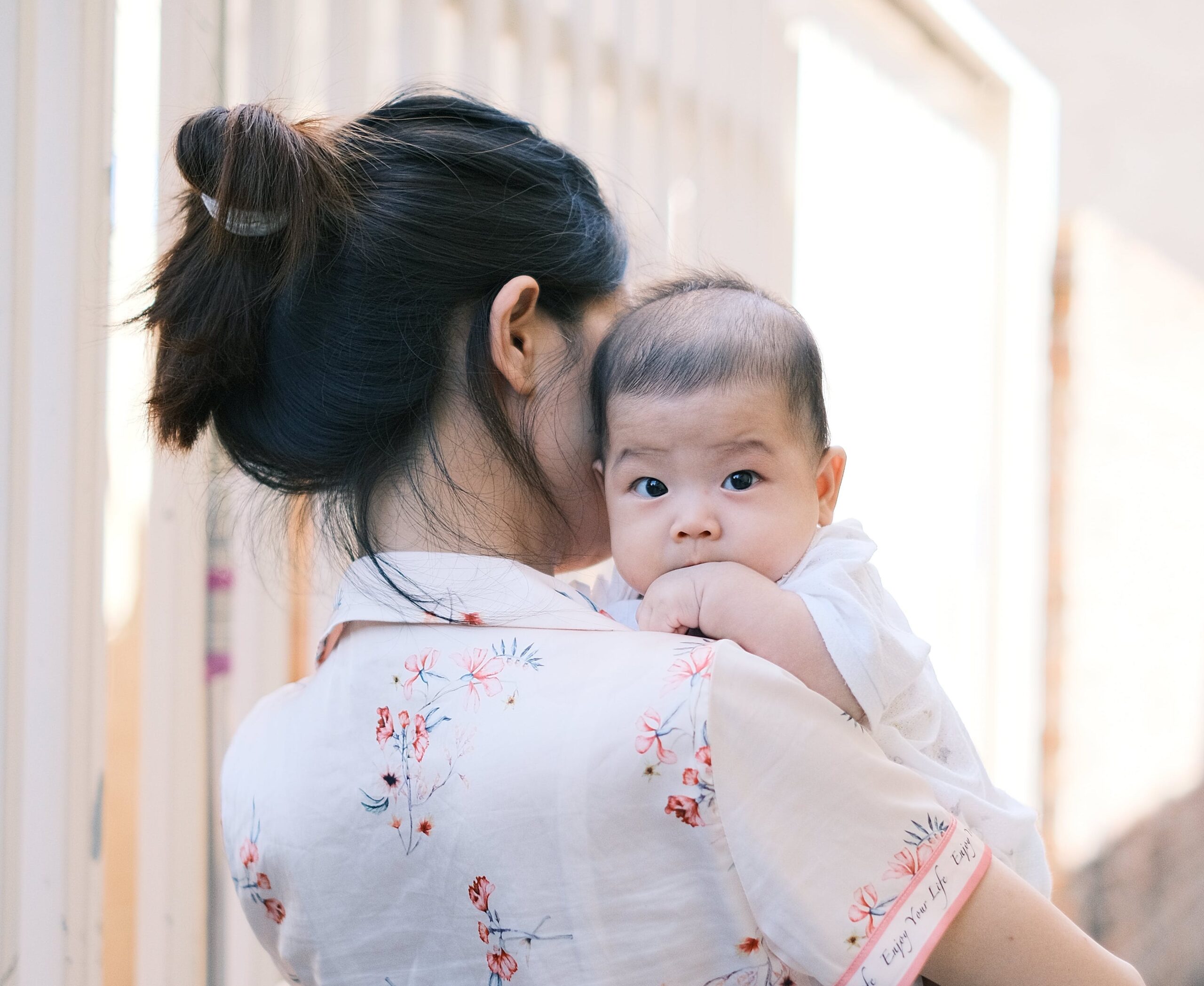 Mom Holding Baby Over Shoulder | The Peaceful Sleeper