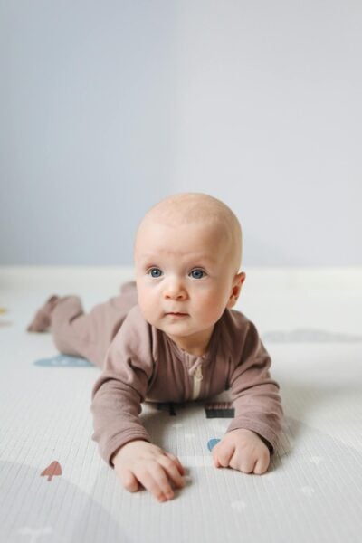 Baby on Tummy - When Can You Start Sleep Training Blog | The Peaceful Sleeper