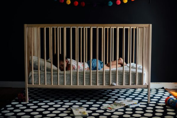 Toddler Laying in Crib | The Peaceful Sleeper