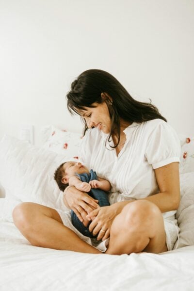 Mom Holding Baby | The Peaceful Sleeper