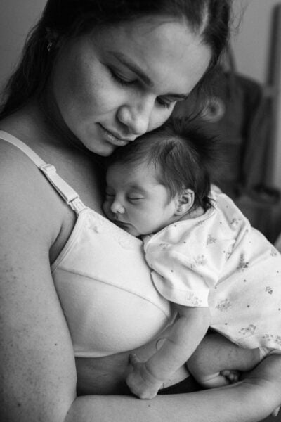 Mom Holding Baby | The Peaceful Sleeper