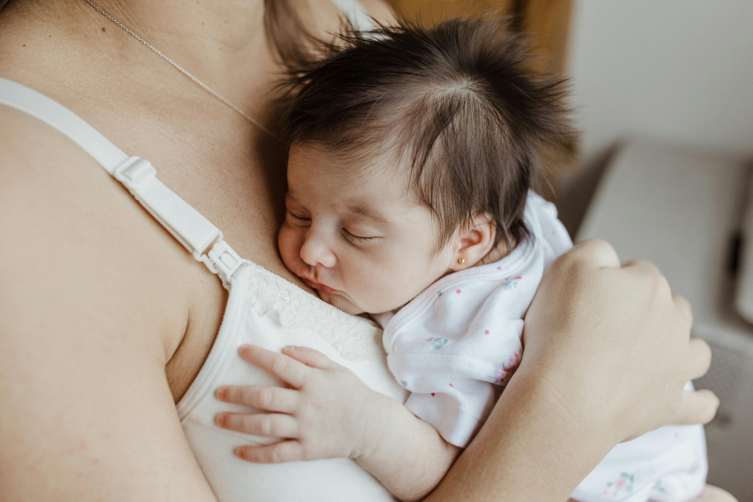 Mom Holding Baby to help soothe him | The Peaceful Sleeper