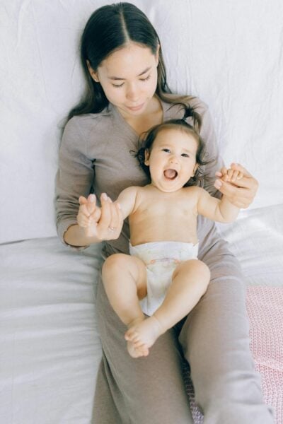 Mom Holding Baby | The Peaceful Sleepr
