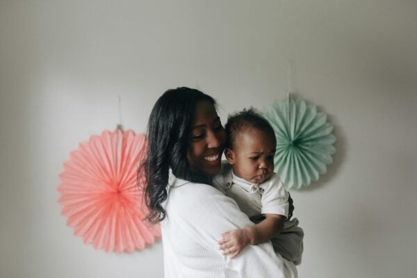 Mom Holding Baby | The Peaceful Sleeper