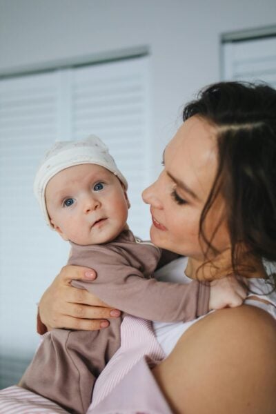 Mom Holding Baby | The Peaceful Sleeper