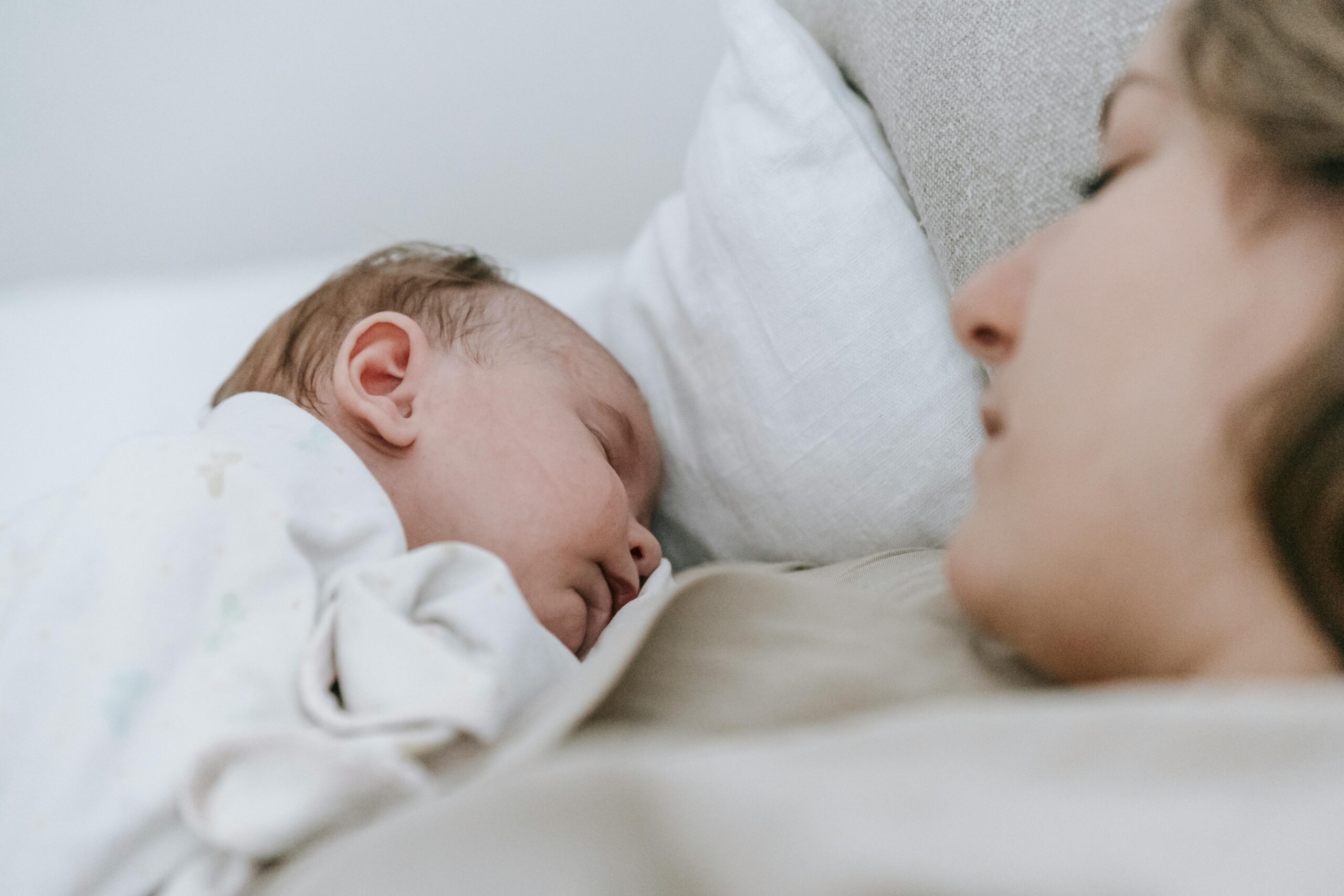 Mom Holding Sleeping Baby
