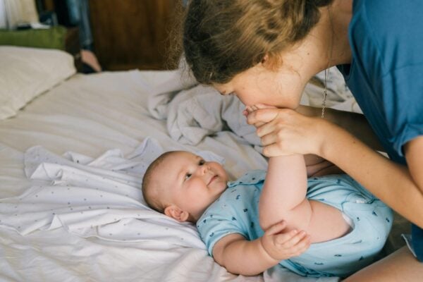 Mom Kissing Baby's Feet | The Peaceful Sleeper